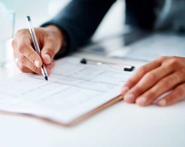Pricing person looking at paperwork