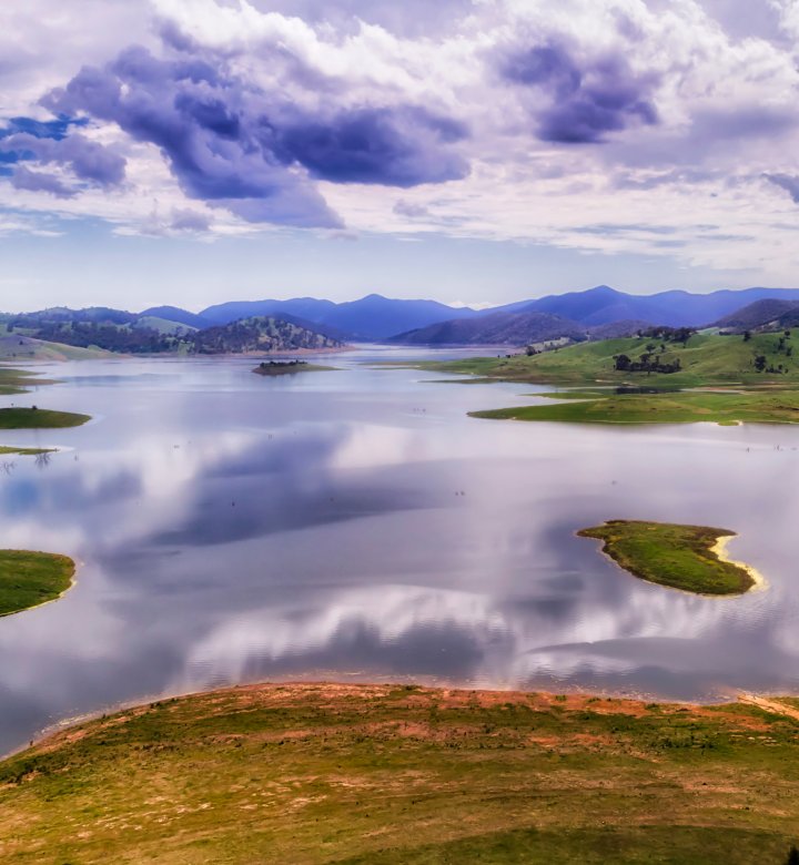 Large lake with reflection of sky and clouds in the water