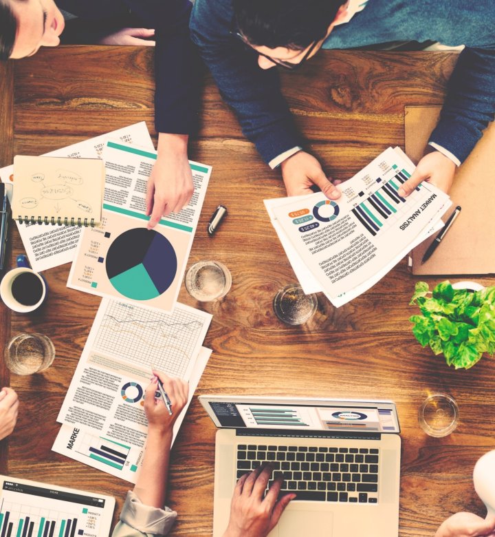 competitive neutrality group reviewing documentation paper and computer