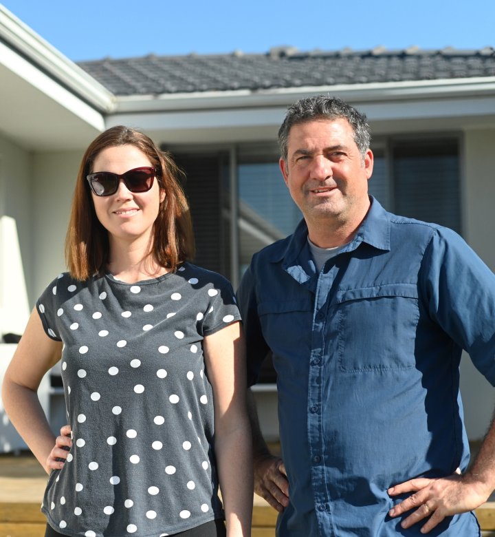 Male and Female outside house