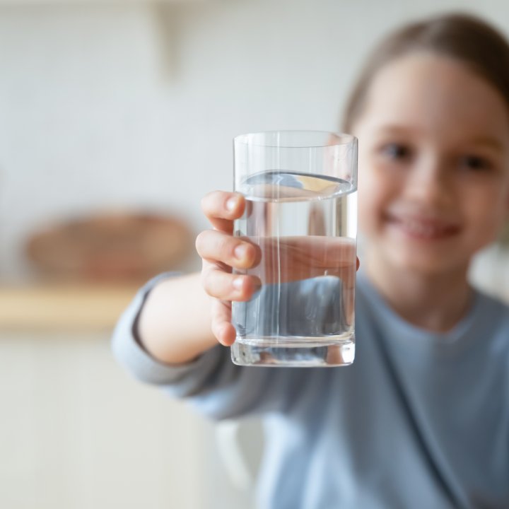 child with glass of water