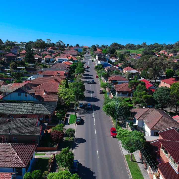 Aerial drone view of Suburban Sydney houses roof tops parks and streets