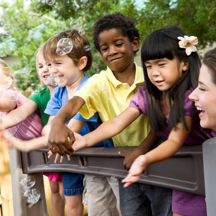 children playing with bubbles